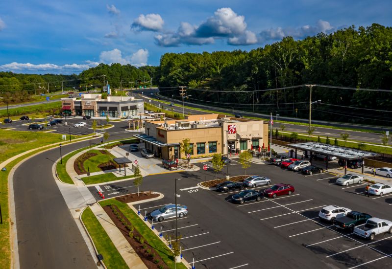 Northwood Ravin Portfolio, Construction, CARRAWAY VILLAGE RETAIL in Chapel Hill, NC, retail shopping mall with plenty of parking and green trees surrounding the area