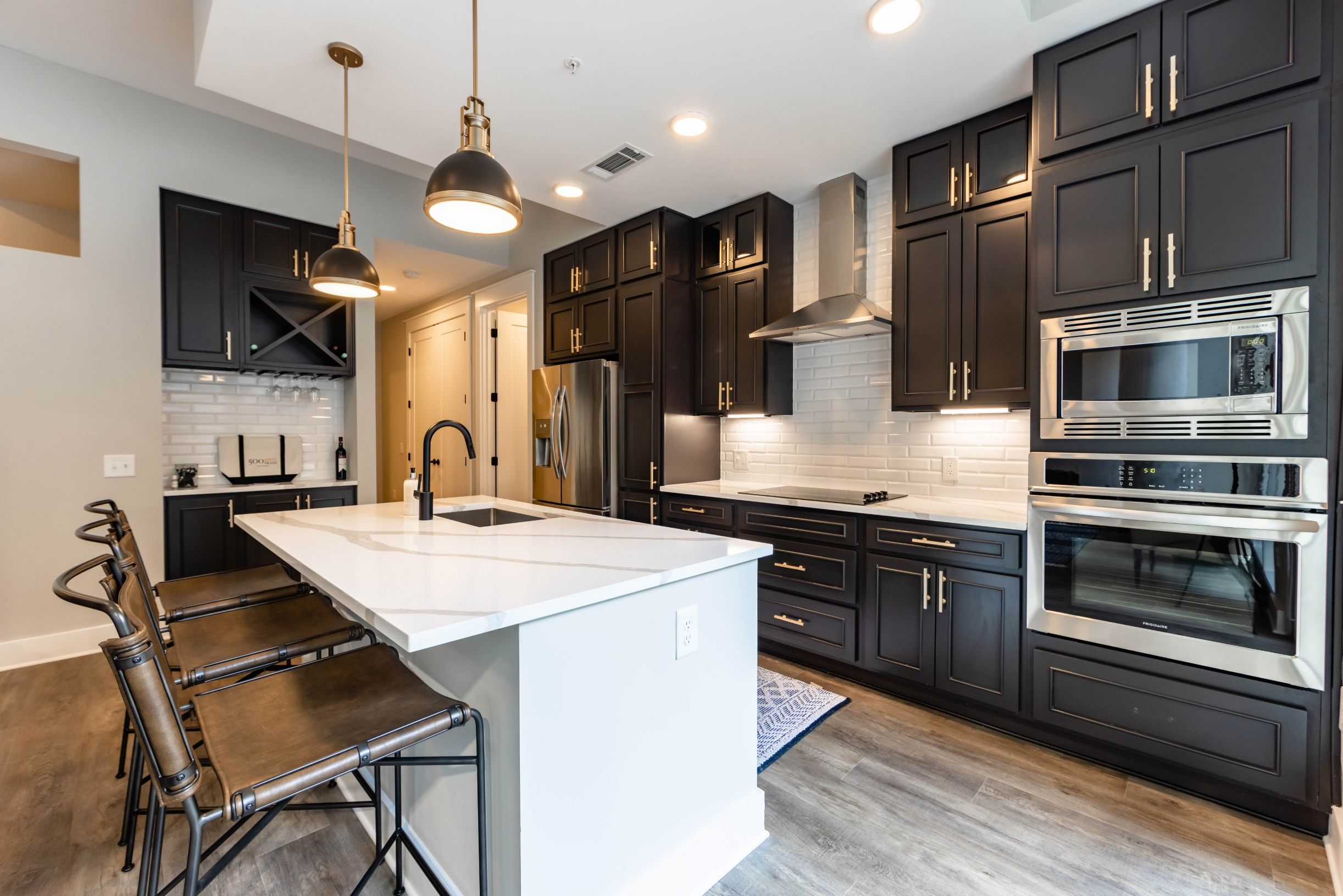 Luxury Charlotte, NC apartment kitchen with quartz countertops and a kitchen island