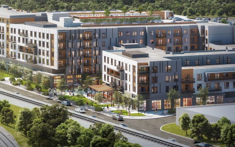 Northwood Ravin Portfolio, Construction, HALO in East Decatur, GA rendering of a new large multi-family apartment community with beautiful neighborhood, green trees, and retail shops and restaurants on the first floor