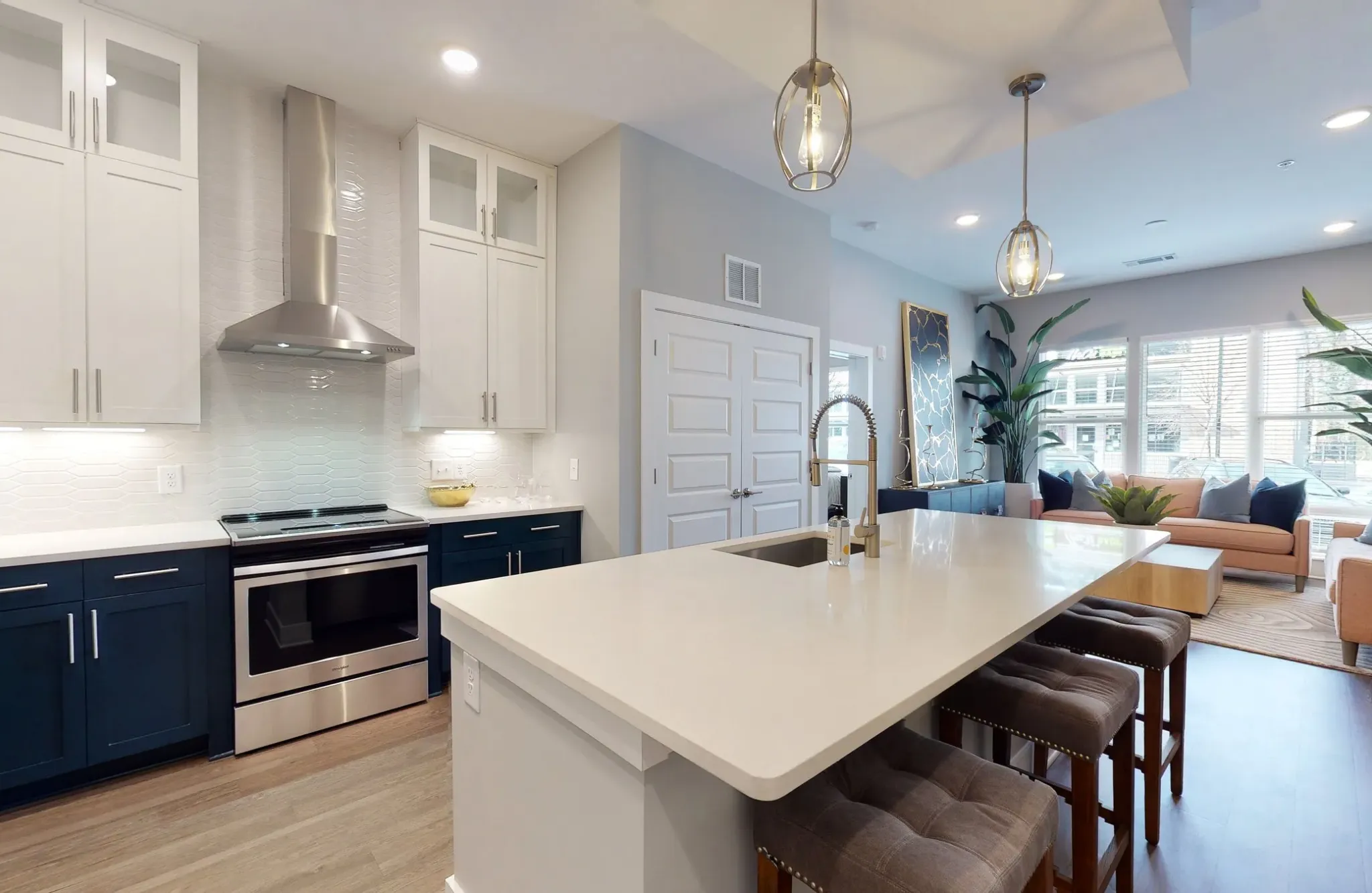 Kitchen counter with island and view into living area