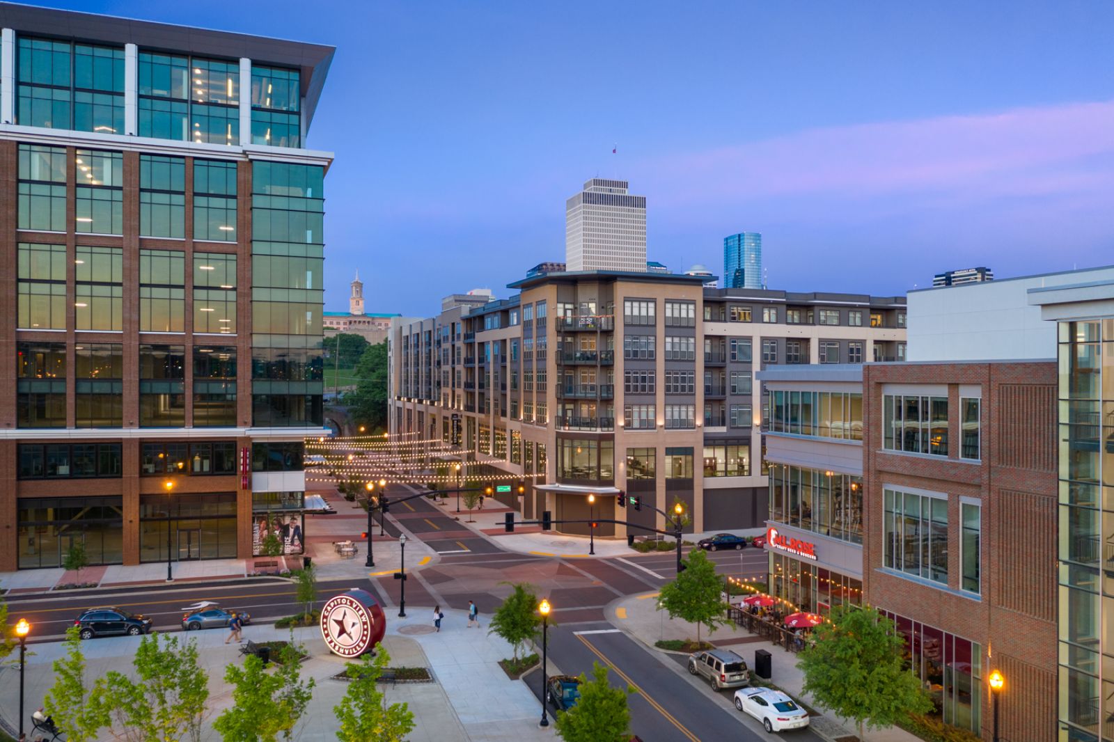 Northwood Ravin Property Management Portfolio, THE LUCENT AT SUNRISE in Kissimmee, FL, multi-family, multi-story apartments with balconies, green grass and palm trees