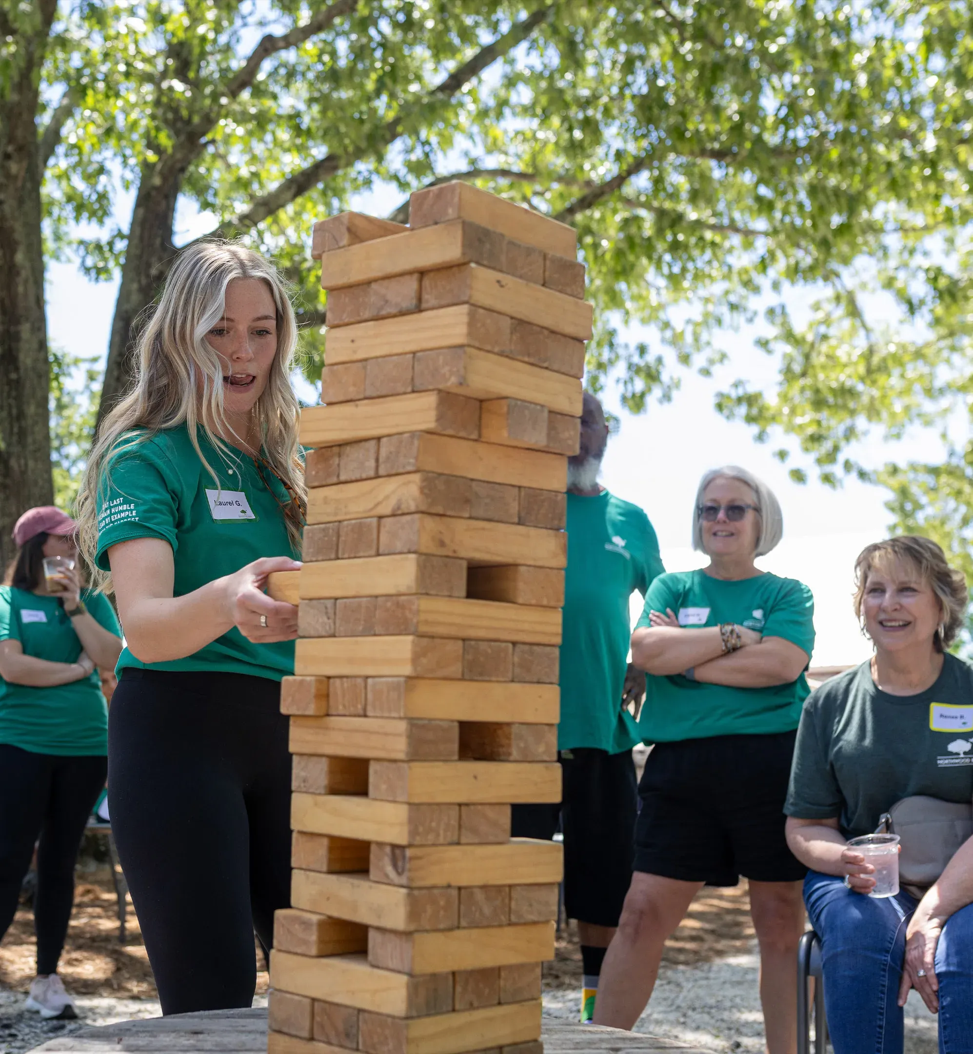 Northwood Ravin team members playing outdoor jenga game